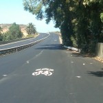 NewSharrowOldBridge "Sharrows," sharing arrows remind motorists that cyclists must use the right hand lane when bike lanes end. This installation is at one of the historic 4-lane bridges on Old Hwy. 101.
