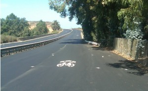 "Sharrows," sharing arrows remind motorists that cyclists must use the right hand lane when bike lanes end. This installation is at one of the historic 4-lane bridges on Old Hwy. 101.